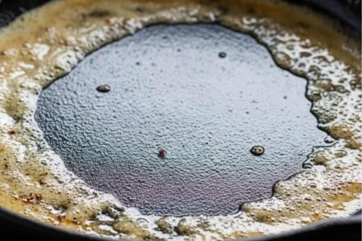 Melt butter in the cast iron skillet over medium heat.