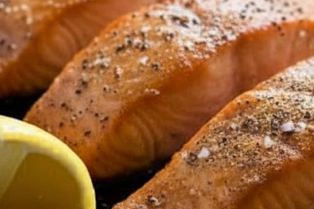 Tuck in lemon wedges around the salmon in the cast iron skillet.