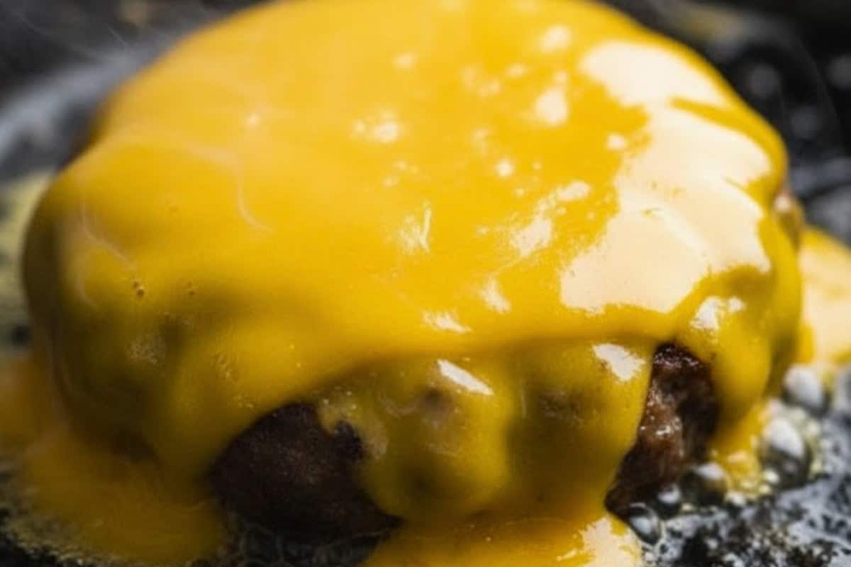In the last minute or two of cooking, top each patty with a slice of cheddar - 7