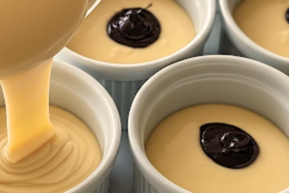 Fill the ramekins with batter and spoon 1 tablespoon of the ganache into the center of each ramekin.