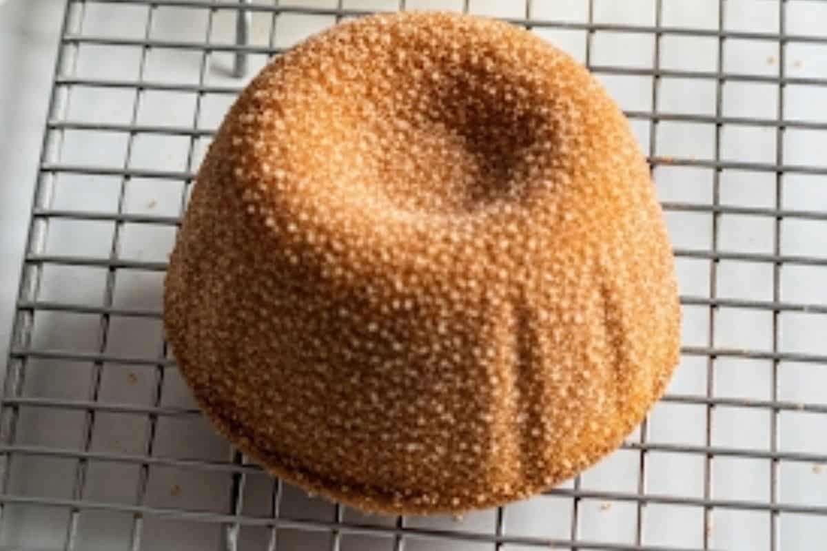 Brush with melted butter and gently roll each cake in the sugar cinnamon mixture.