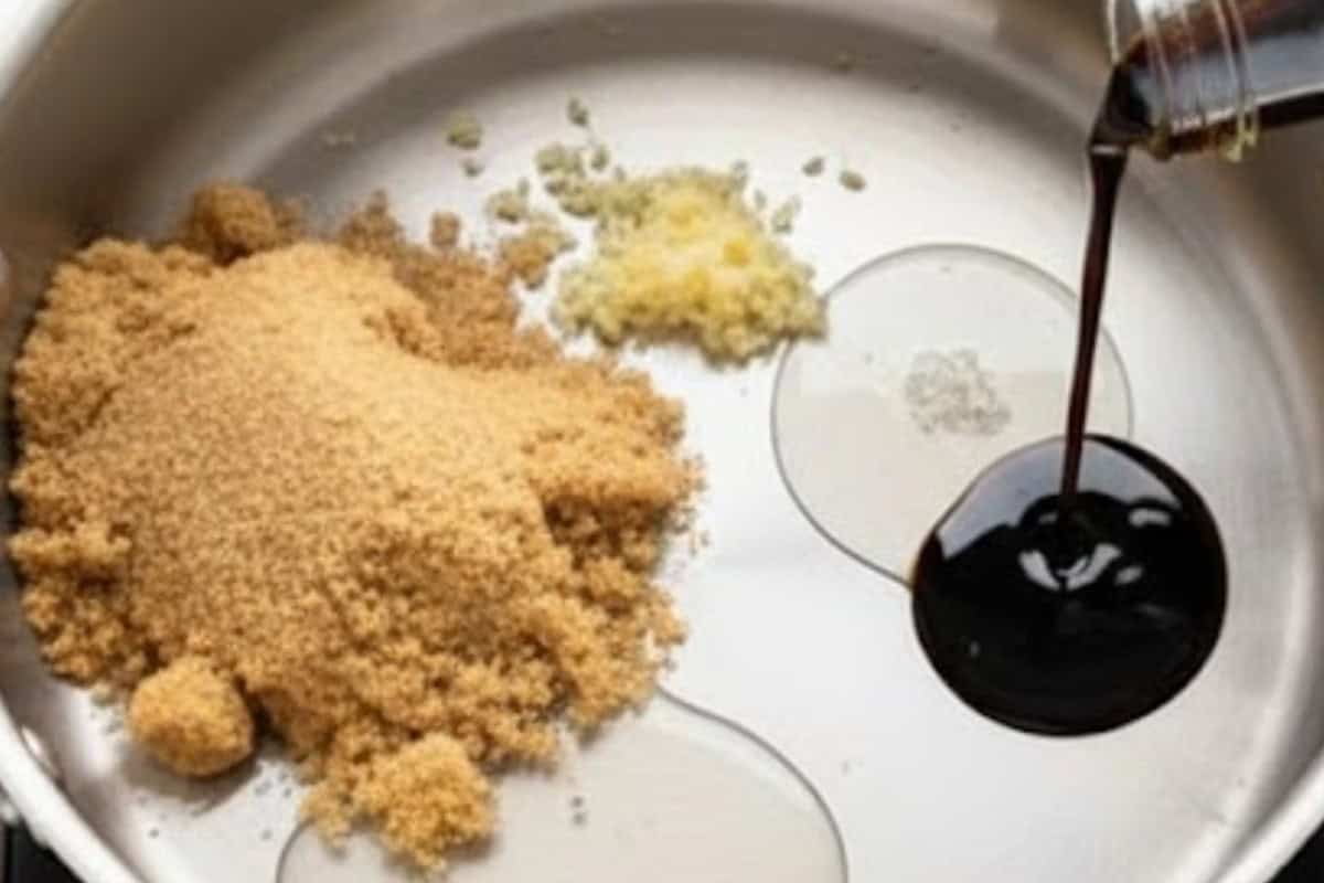 Combine soy sauce, sake, mirin, brown sugar, garlic and water in a sauce pan.