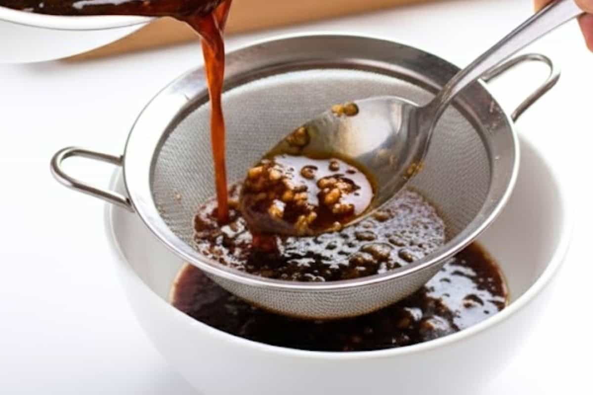 Remove the sauce pan from the heat and remove the garlic and set aside 1/4 of the sauce.