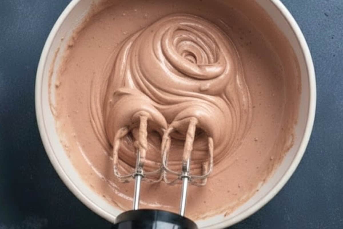 Use a handheld mixer on low to medium speed to finish blending the mixture.