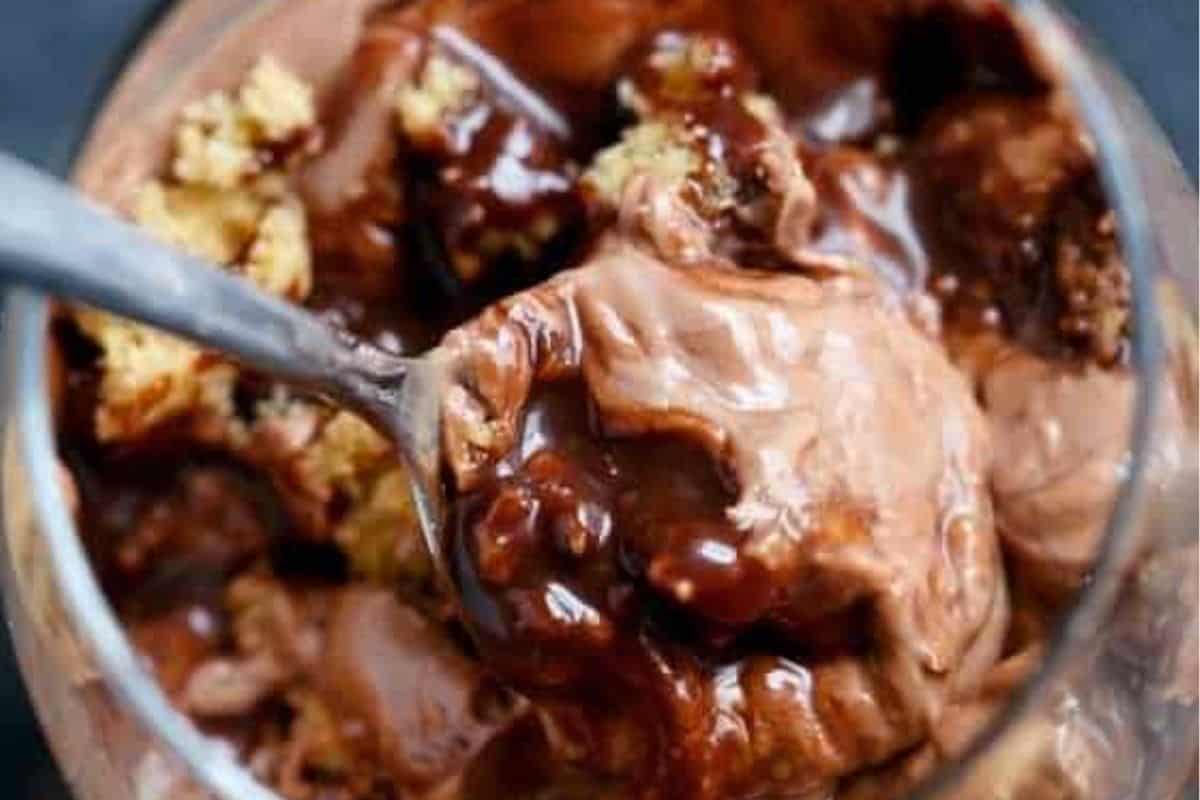 Add a spoonful of cheesecake mixture, drizzle with fudge, and give it a light swirl. Repeat the layering, finishing with the remaining cookie pieces and a final drizzle of sauce.