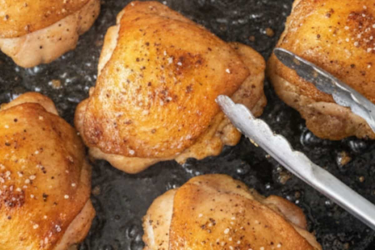 Cook the chicken thighs in a cast iron pan.