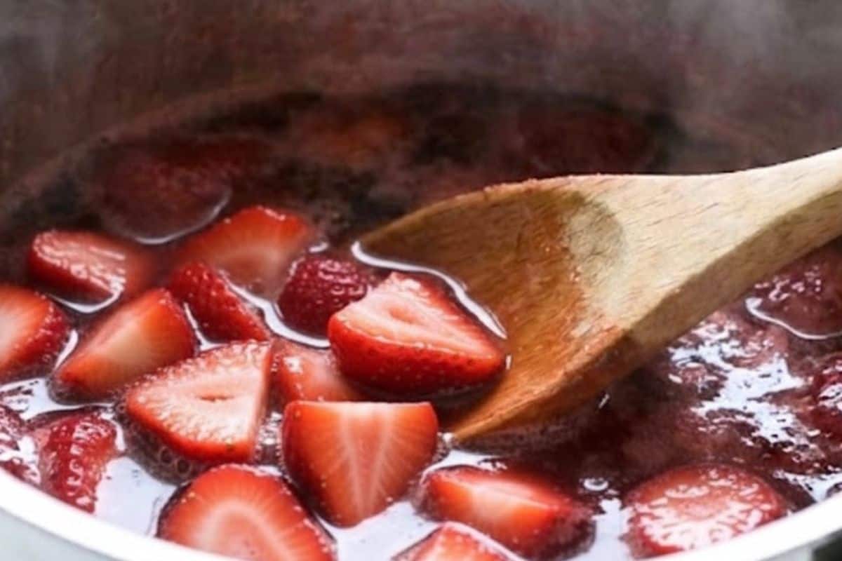 Combine strawberries sugar and water in a sauce pan. - 3