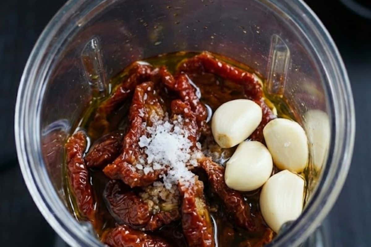 Preheat oven to 220℃ | 430℉, then blend the sundried tomatoes with their oil, 4 garlic cloves, and salt  - 3