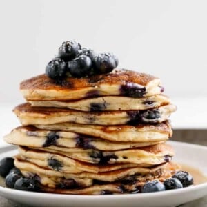 Blueberry Ricotta Pancakes stack on each other
