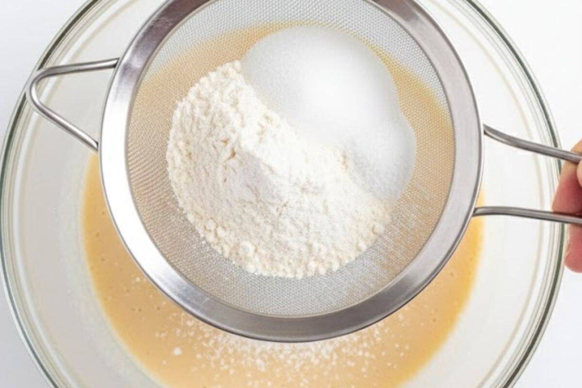 Sift in the self-raising flour, sweetener or sugar, baking powder, and salt. - 4