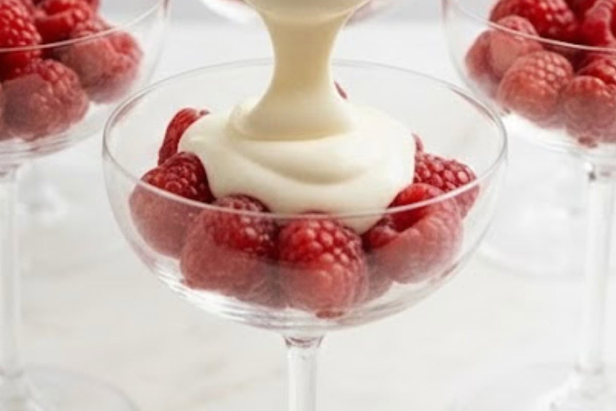 Divide 1 cup of raspberries across 6 small glasses, gently pressing them into the base. Spoon the cheesecake mixture over the berries - 4