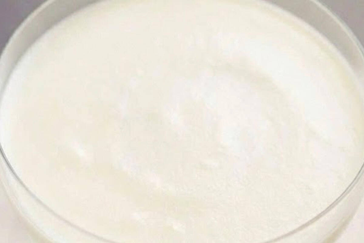 Remove glasses from the fridge and divide the whipped cream evenly over the cheesecake layer. - 8