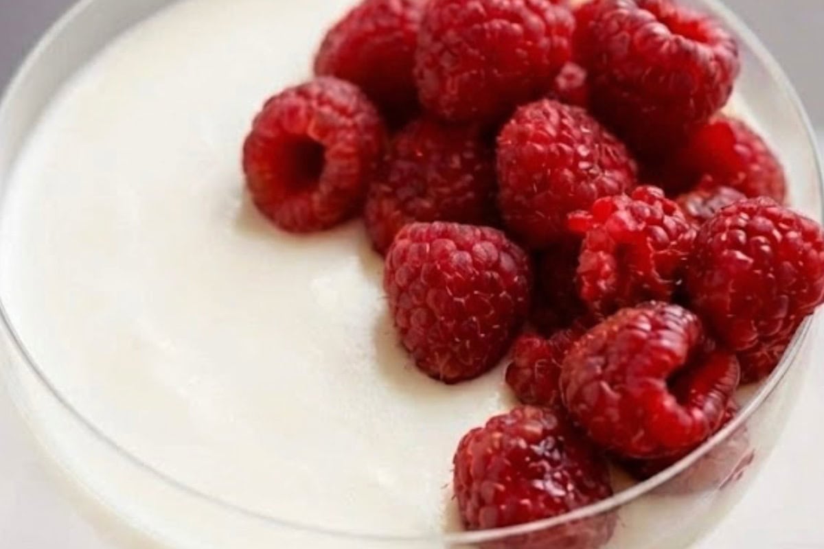 Add the remaining raspberries on top of each glass, letting a few settle naturally into the cream. - 9
