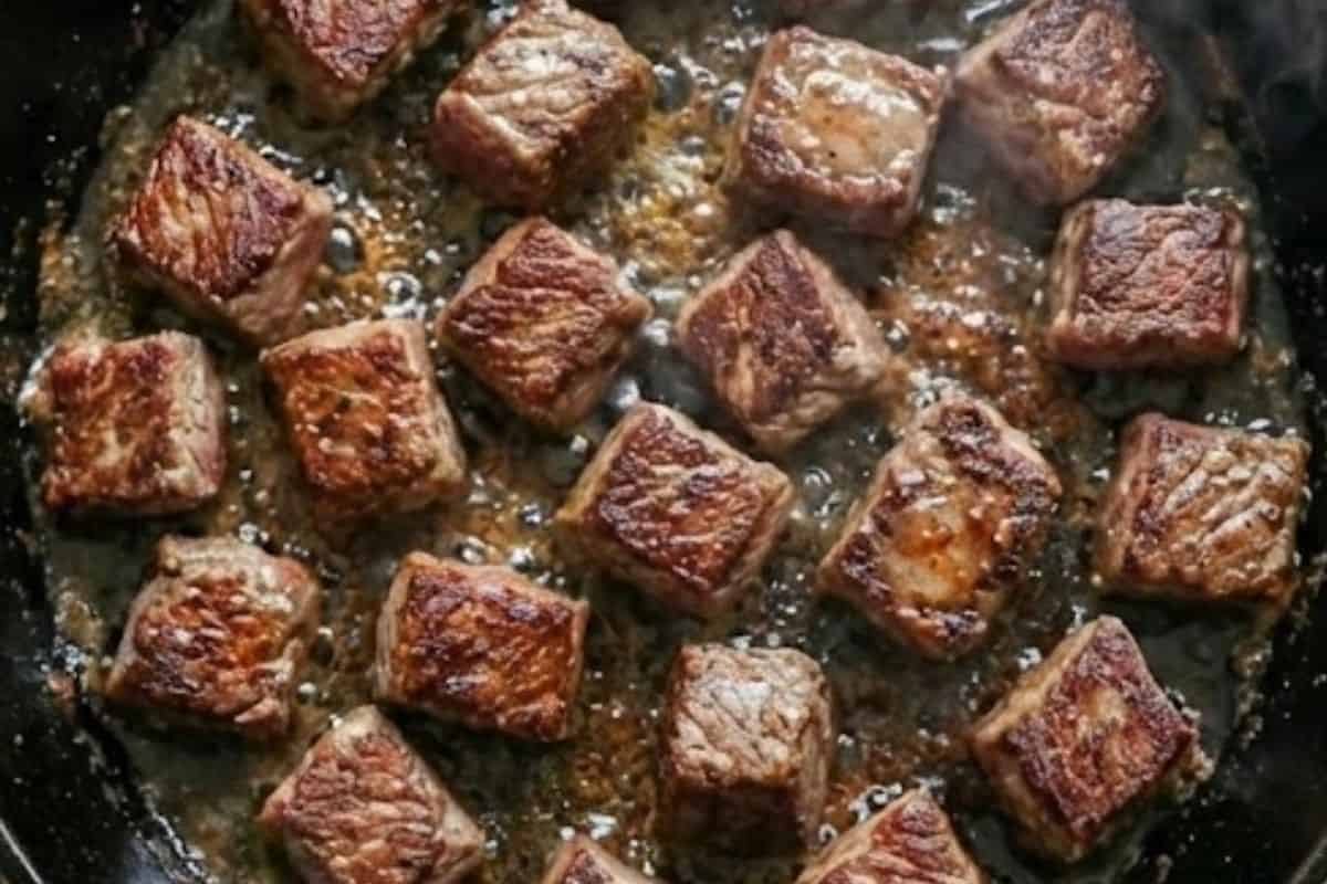 Heat 1 tablespoon of oil in a nonstick skillet and sear the beef in batches until browned all over. - 4