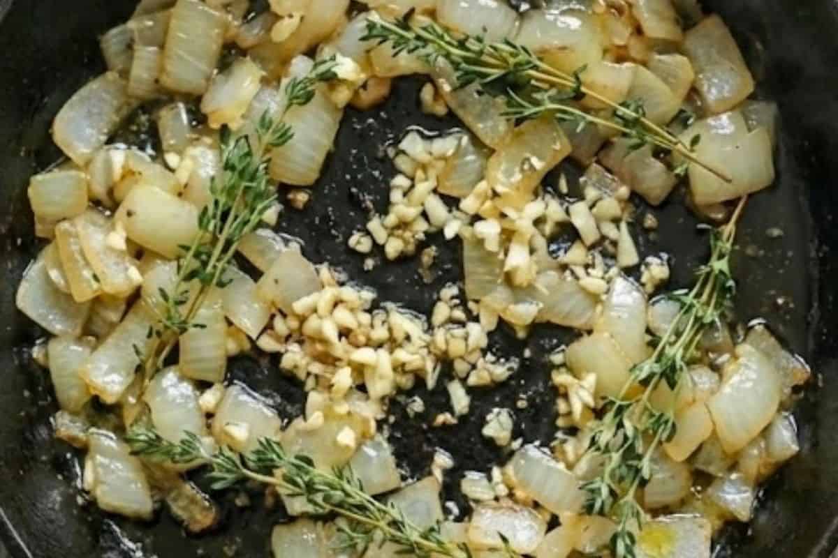 Add the oil to the same pan and sauté onion until soft. Stir in the garlic and thyme, - 5