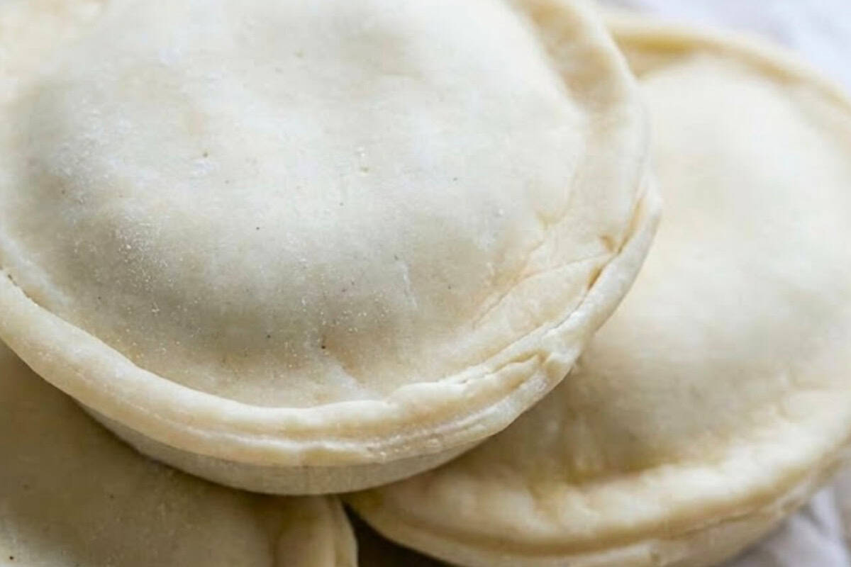 Press the pastry bases into the moulds, spoon in 2–3 tablespoons of beef mixture, and brush the edges with water. Place the pastry lids on top and seal the edges with a fork or by crimping. - 9