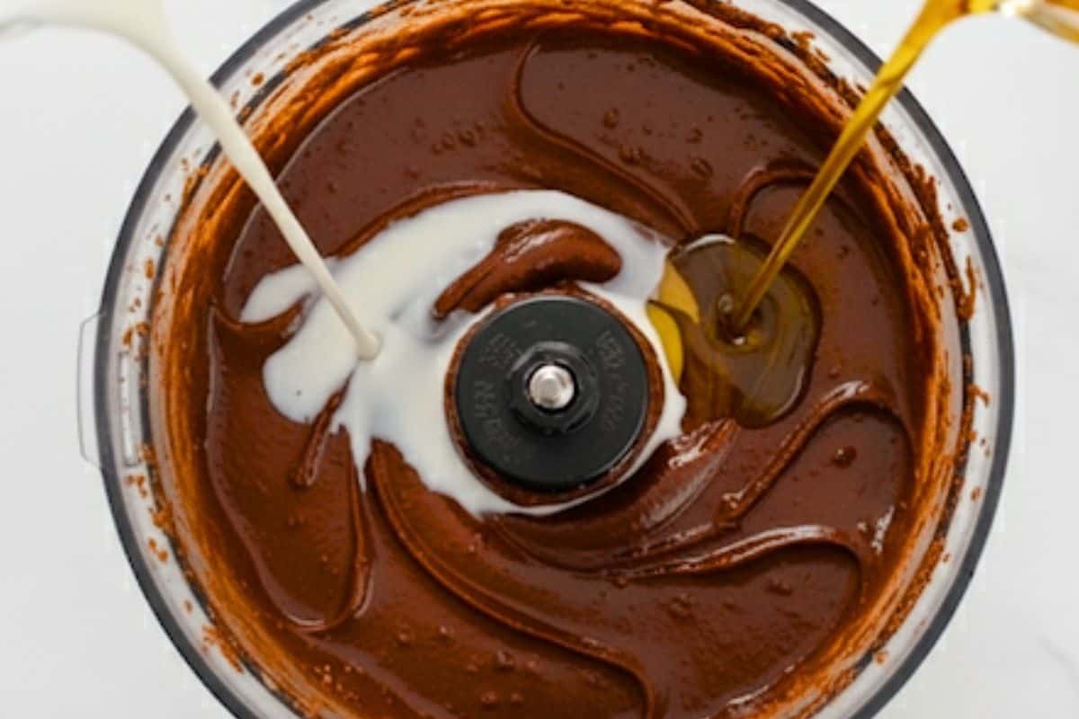 Drizzle the warm milk and hazel nut oil until glossy and spreadable.