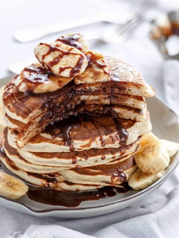 Nutella Stuffed Banana Pancakes stack on each other on a plate