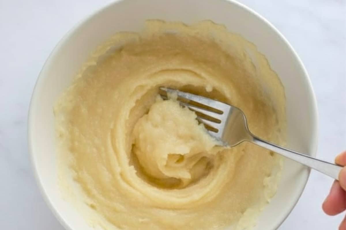 In a large bowl, mash the ripe banana until smooth and creamy.