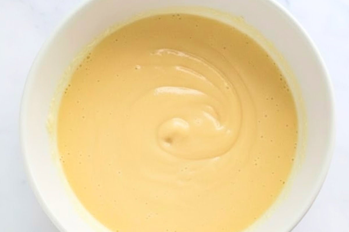 Give the batter a light whisk and avoid overmixing.