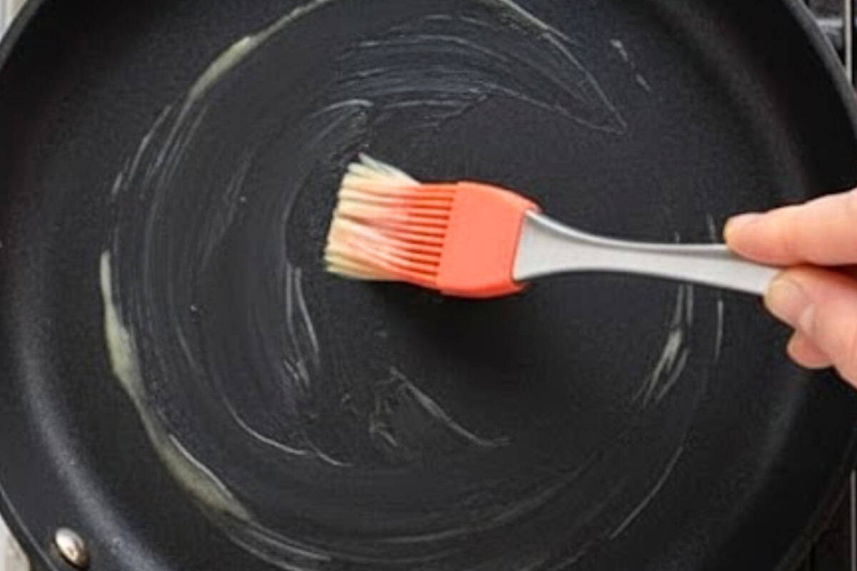 Warm a nonstick skillet over low-medium heat, making sure to brush it lightly with butter