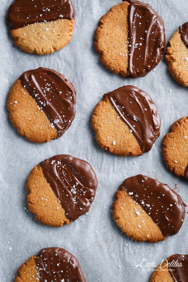 Salted Chocolate Dipped Peanut Butter Cookies | https://cafedelites.com