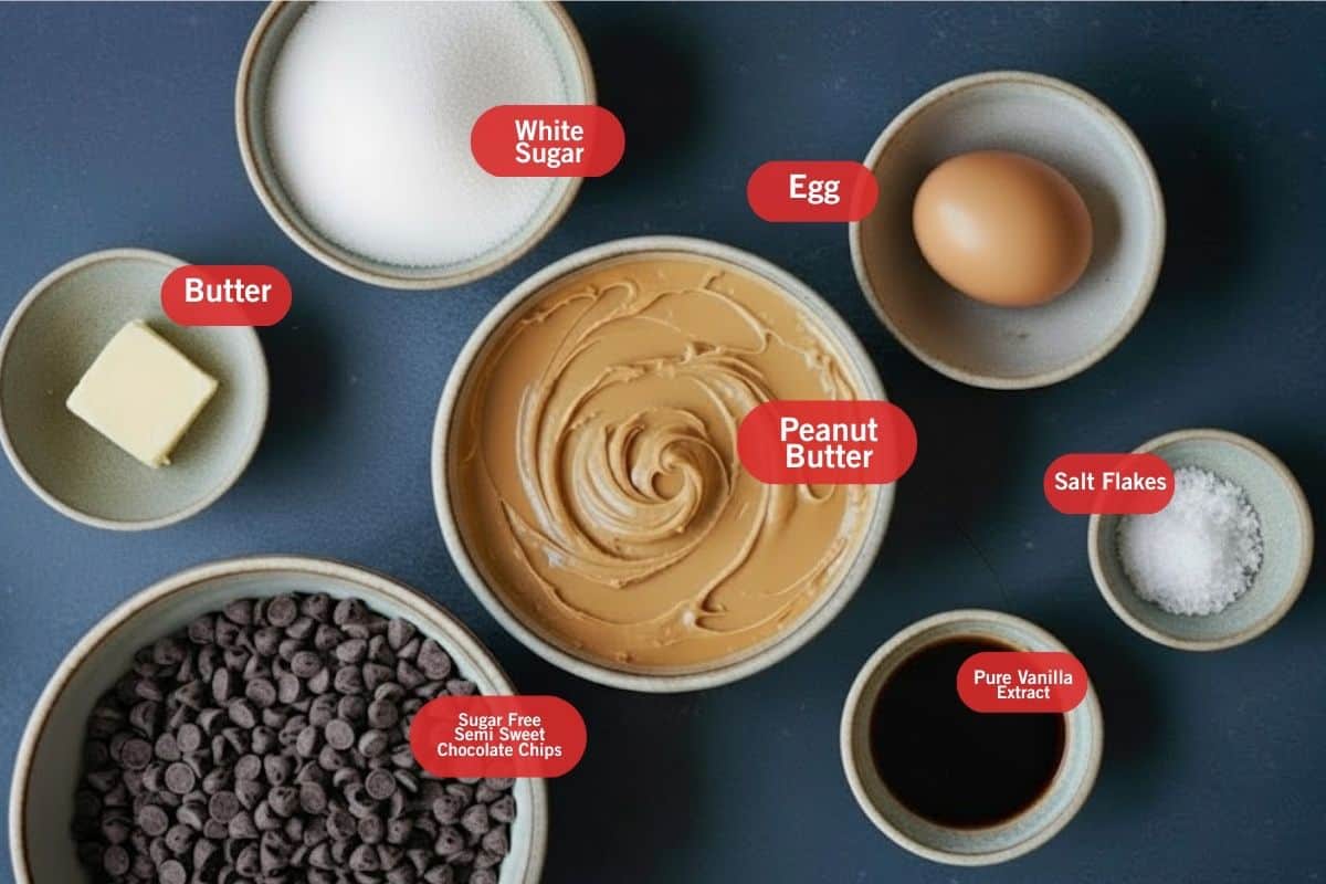 Flat lay photo of ingredient of white sugar, egg, peanut butter, butter, sugar free semi sweet chocolate chips, pure vanilla extract - 2