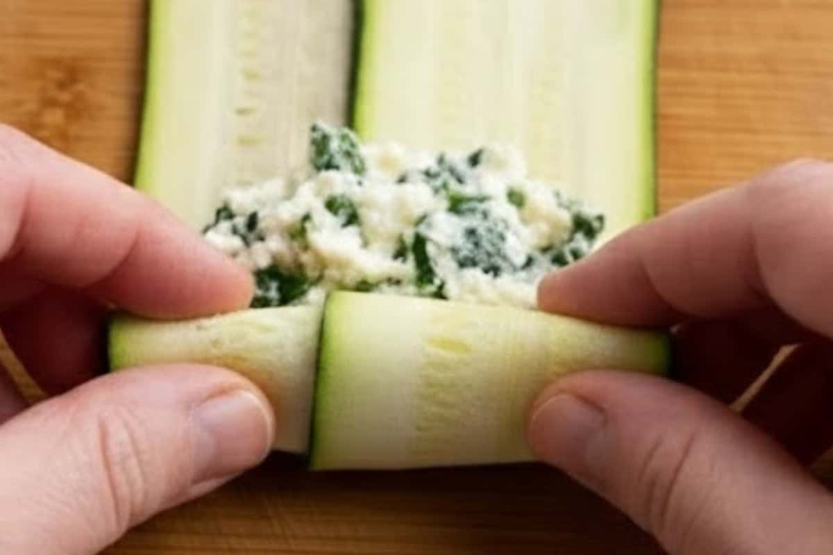 Lay two zucchini ribbons overlapping, spoon 1 to 2 tablespoons of the mixture - 6