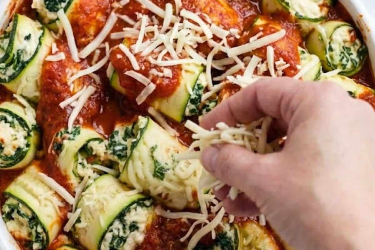 Repeat with the remaining zucchini and filling until the dish is full. Spoon remaining sauce over the cannelloni and sprinkle with the rest of the mozzarella cheese. - 7