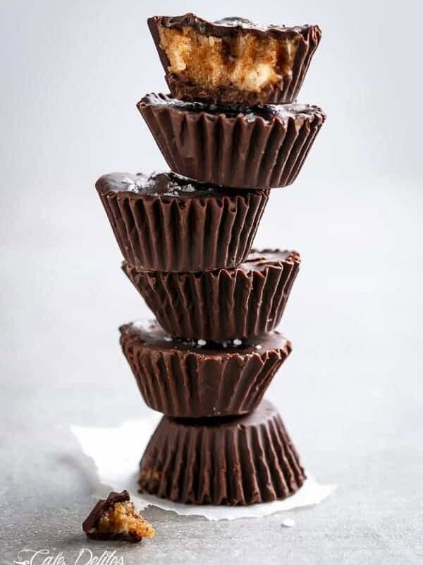 Chocolate Chip Cheesecake Cookie Dough Cups being stack on each other