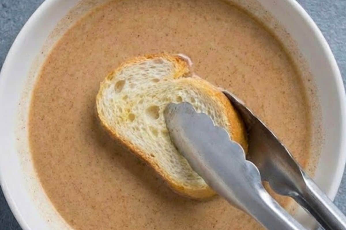 Quickly dip each slice into the egg mixture, turning to coat both sides evenly