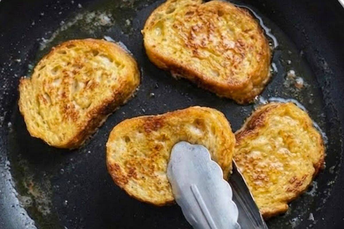 Heat half a tablespoon of butter in a non stick pan over low to medium. Cook soaked bread in batches of 4 to 5 slices