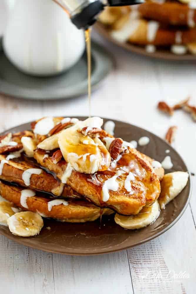 Banana Bread French Toast drizzled with a Cream Cheese Glaze | https://cafedelites.com