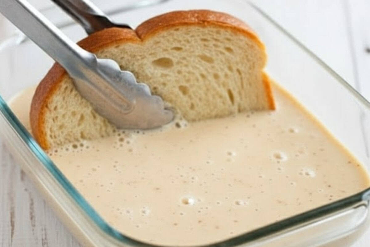 Pour the mixture into a shallow dish and coat each bread slice evenly,