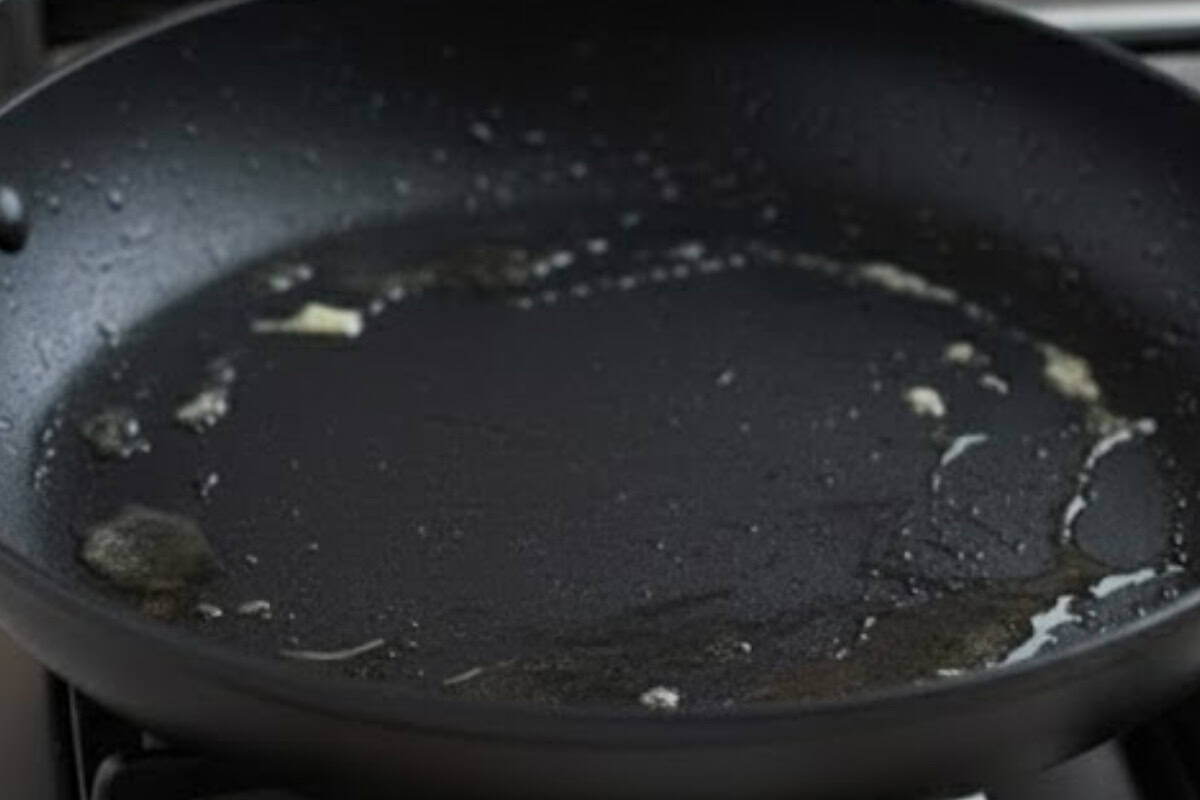Melt butter or spray oil on a pan over low heat