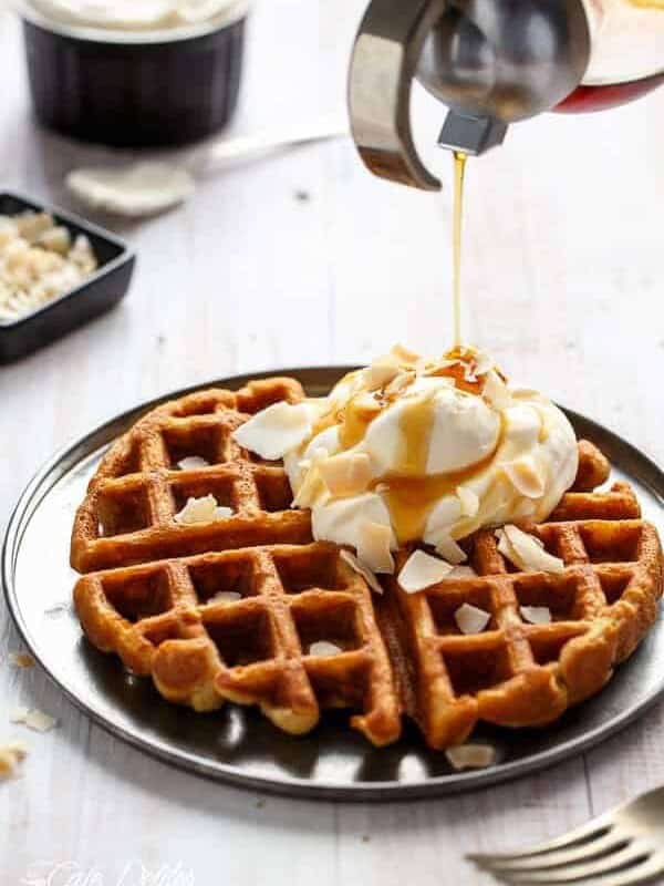 Coconut Cream Pie Waffles with some ice cream scoop and dressing drizzle over the waffles