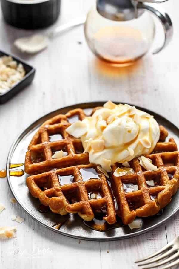  Crispy coconut waffles topped with whipped coconut cream and toasted coconut flakes  Coconut Cream Pie Waffles