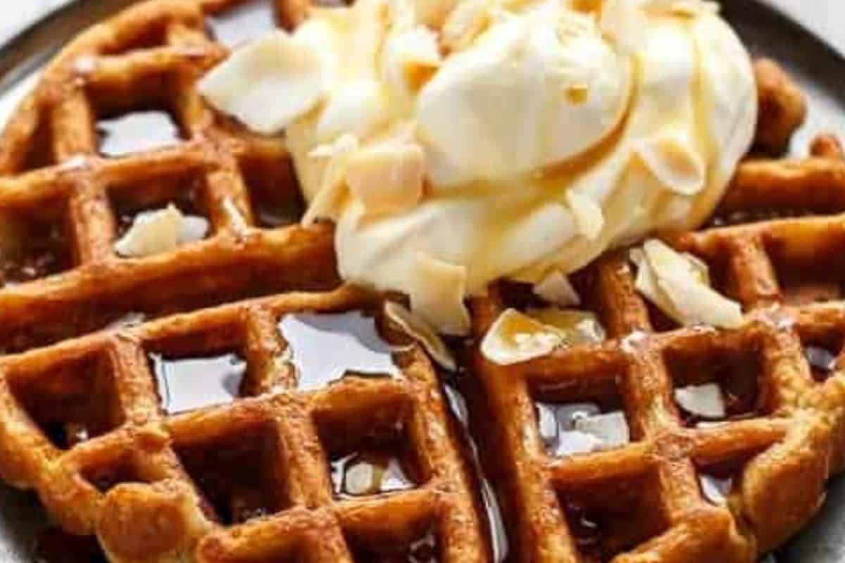 Top the warm waffles with whipped coconut cream and toasted coconut flakes