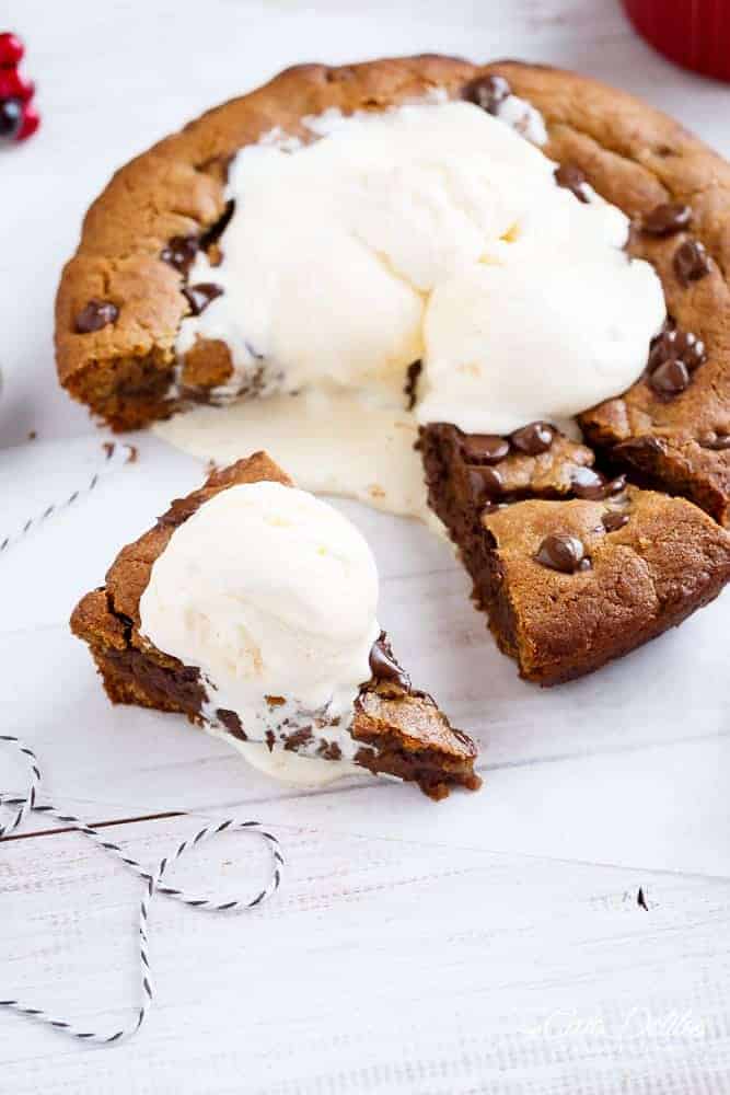 A Nutella Stuffed Browned Butter Gingerbread Skillet Cookie that kids and adults will demolish at Christmas! | https://cafedelites.com