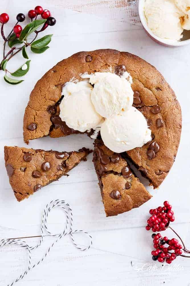 A Nutella Stuffed Browned Butter Gingerbread Skillet Cookie that kids and adults will demolish at Christmas! | https://cafedelites.com