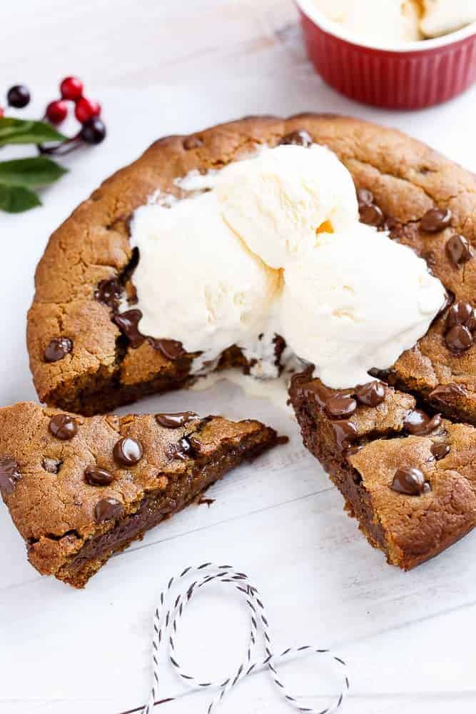 A Nutella Stuffed Browned Butter Gingerbread Skillet Cookie that kids and adults will demolish at Christmas! | https://cafedelites.com