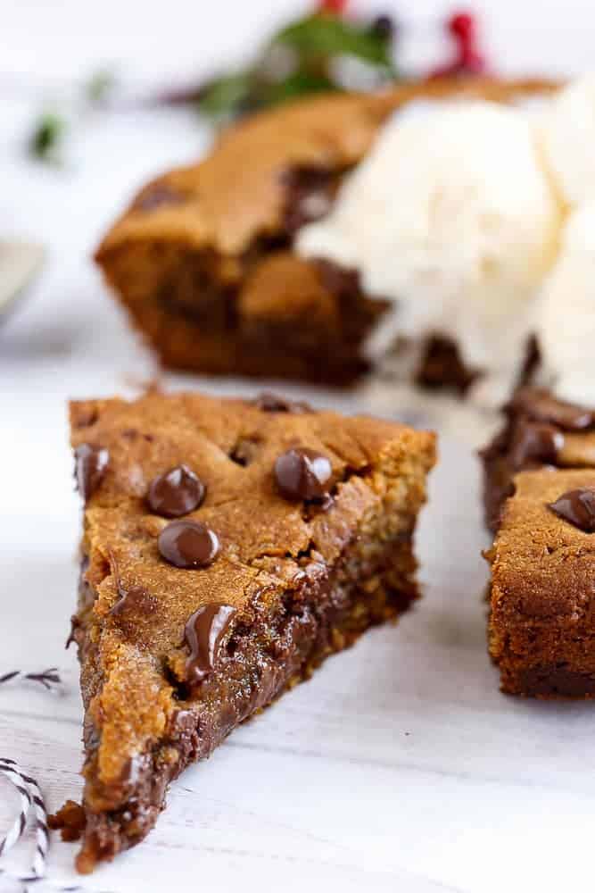 A Nutella Stuffed Browned Butter Gingerbread Skillet Cookie that kids and adults will demolish at Christmas! | https://cafedelites.com