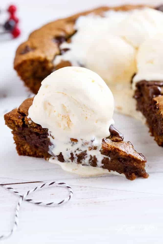 A Nutella Stuffed Browned Butter Gingerbread Skillet Cookie that kids and adults will demolish at Christmas! | https://cafedelites.com