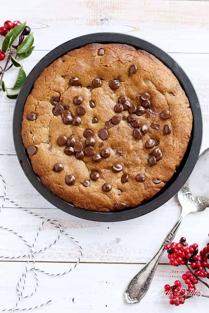 A Nutella Stuffed Browned Butter Gingerbread Skillet Cookie that kids and adults will demolish at Christmas! | https://cafedelites.com