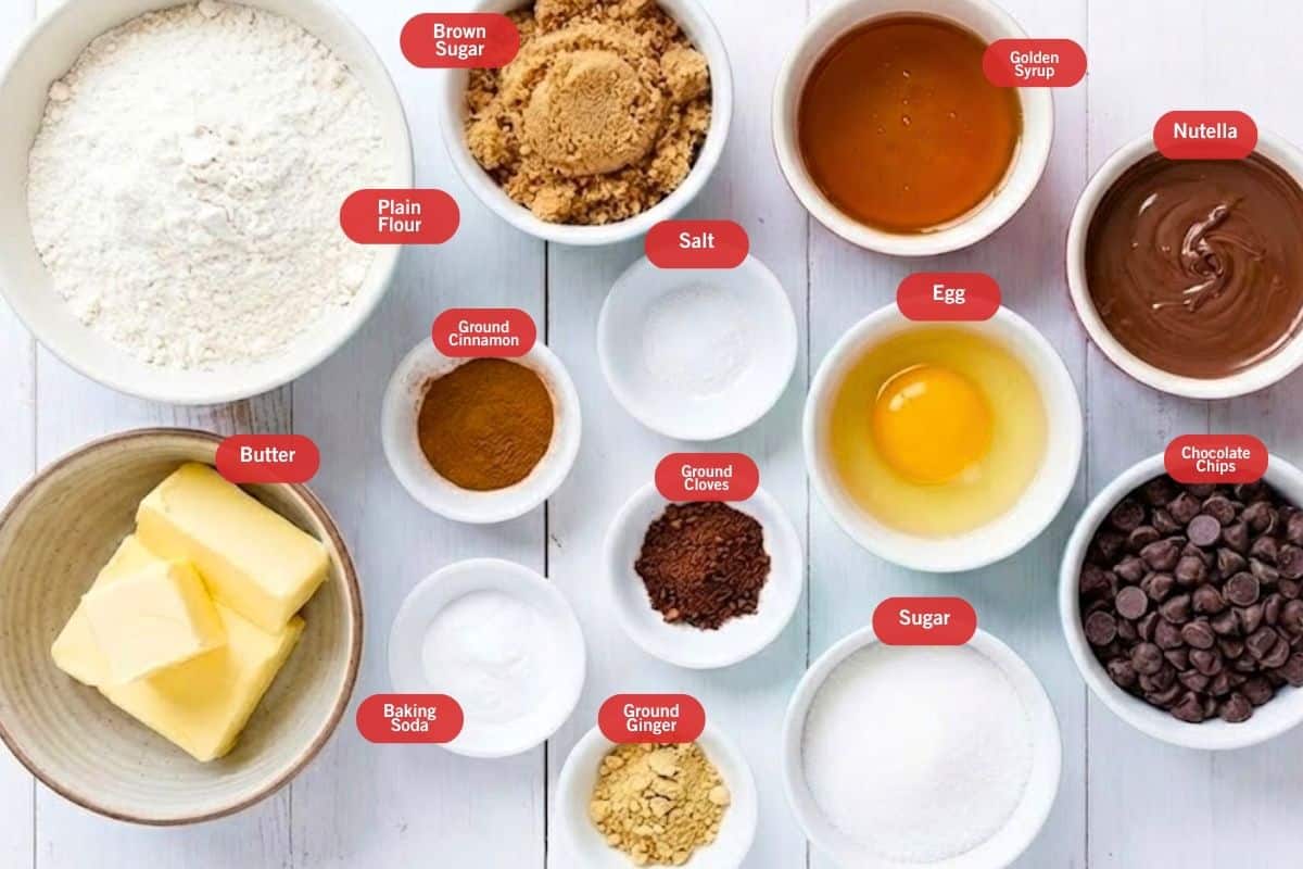 Flat lay photo of ingredient shot of
Nutella Gingerbread Cookies
(plain flour, brown sugar, goldenn syrup, nutella, chocolate chips, egg, salt, ground cinnamon, ground clovers. sugar, ground ginger, butter, baking soda) - 2