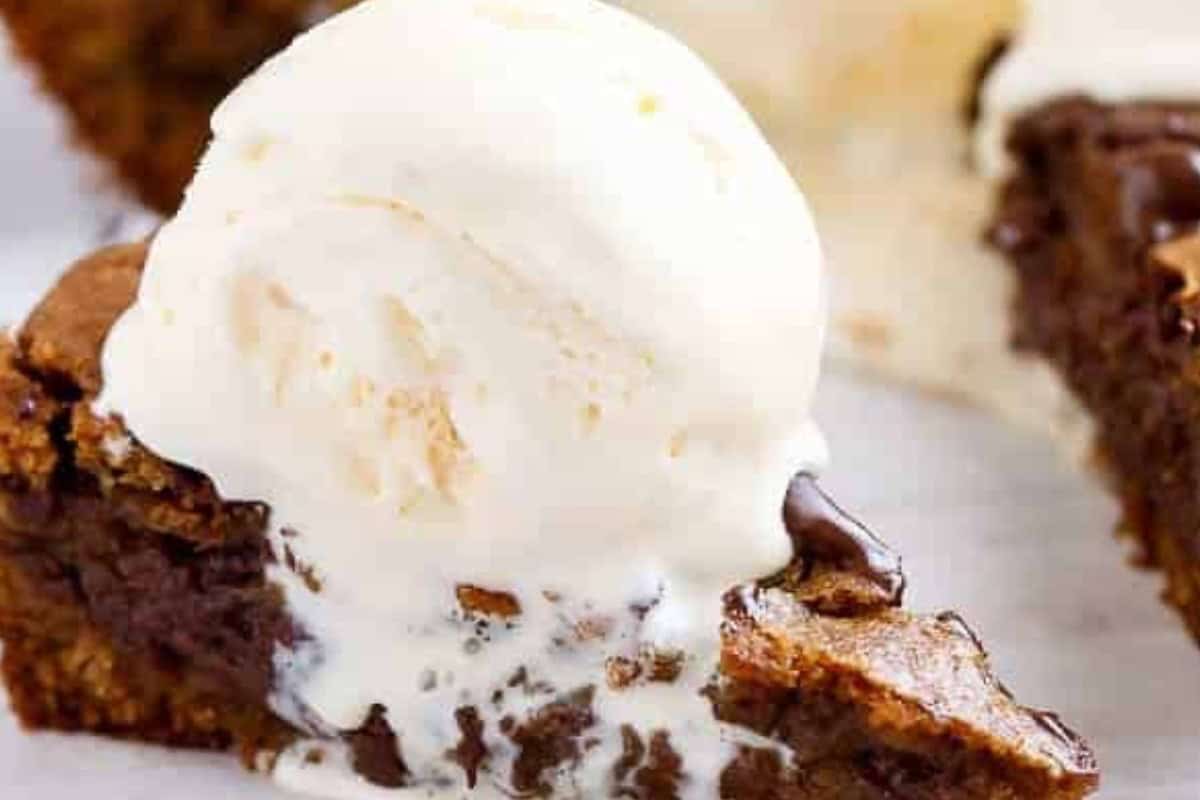 Bake for 25 to 30 minutes until the top is set but the center stays soft and gooey, then serve warm with vanilla ice cream - 10