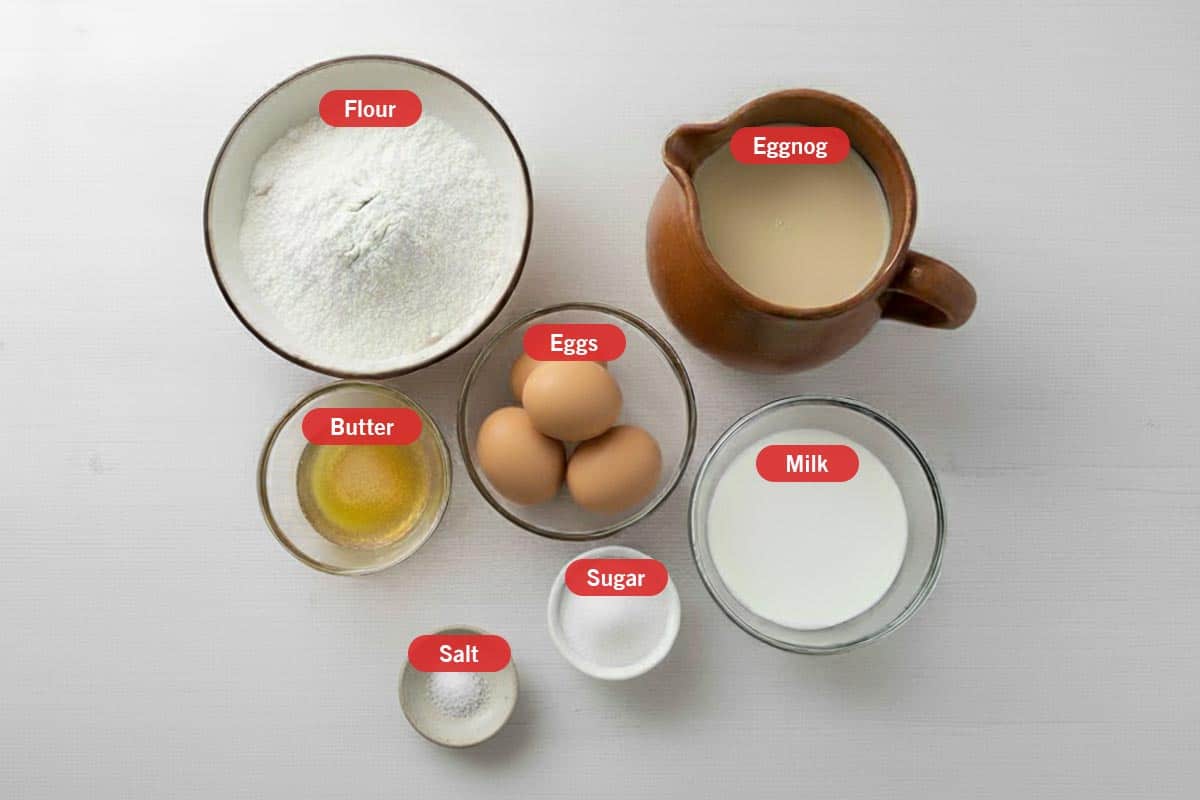 Top shot of ingredients: Flour, eggnog, butter, eggs, milk, sugar and salt.