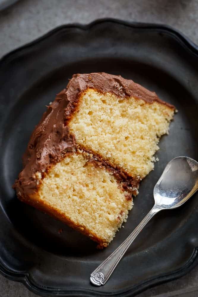 A fluffy and super moist butter cake with Kahlua chocolate cream frosting to make all of your dreams come true! | https://cafedelites.com