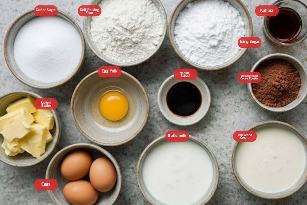 Flat lay photo of ingredient shot of caster sugar, self raising flour, icing sugar, Kahlua, unsweetened cocoa powder ,thickened cream, buttermilk. eggs, egg yolk, salted butter) - 2