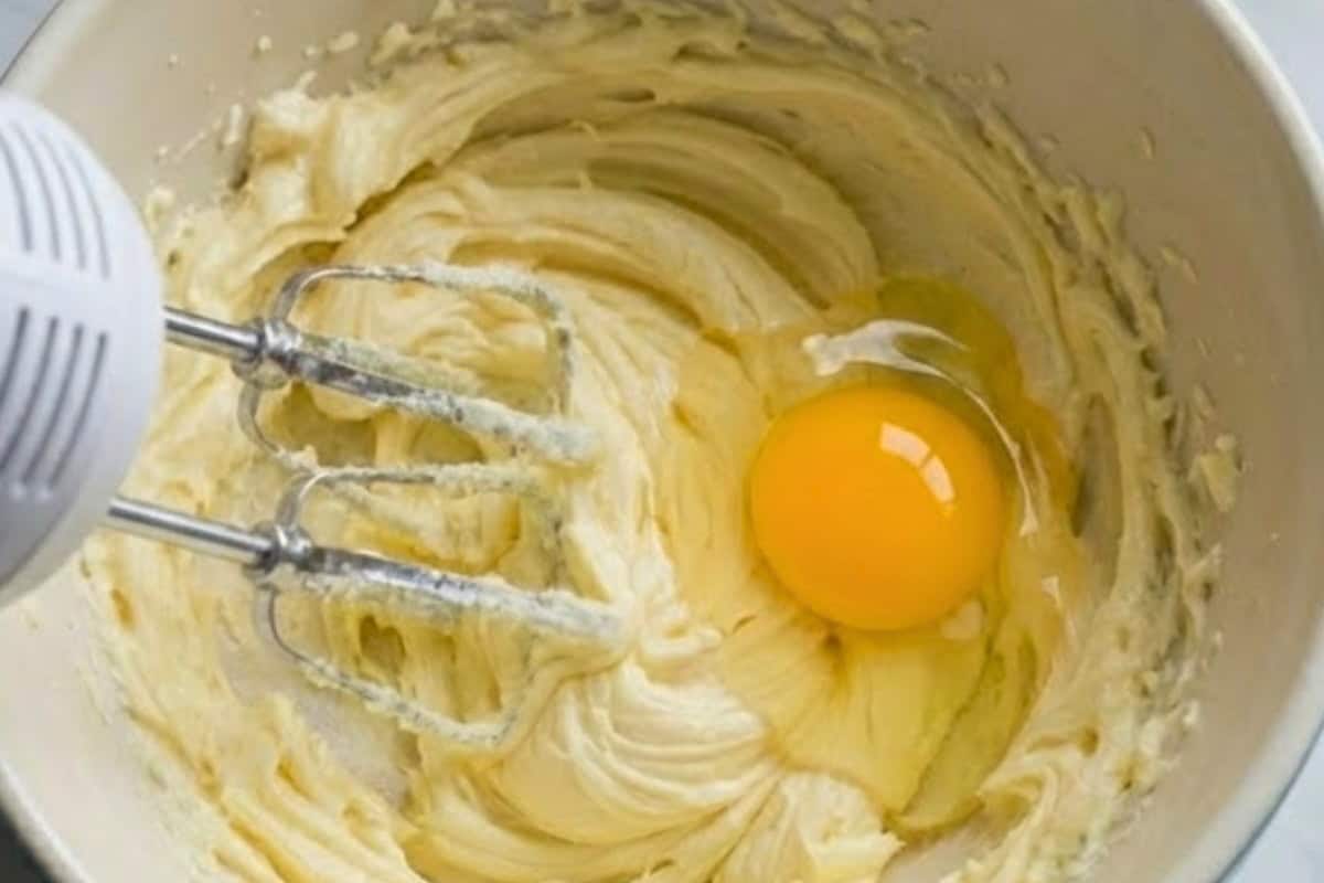 Add eggs one at a time, mixing after each one, then add the extra yolk  - 5